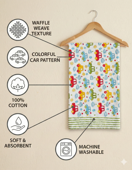 Children's towel with colorful car pattern on a hanger, featuring waffle weave texture, 100% cotton, soft and absorbent properties, and machine washable label.
